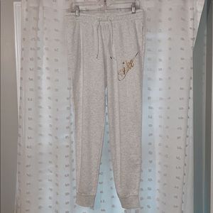 White/ light grey Nike joggers